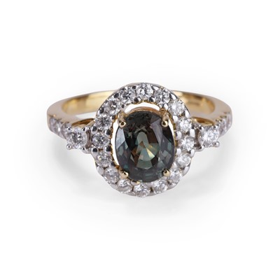 Lot 138 - An 18ct gold chrysoberyl Alexandrite and diamond cluster ring