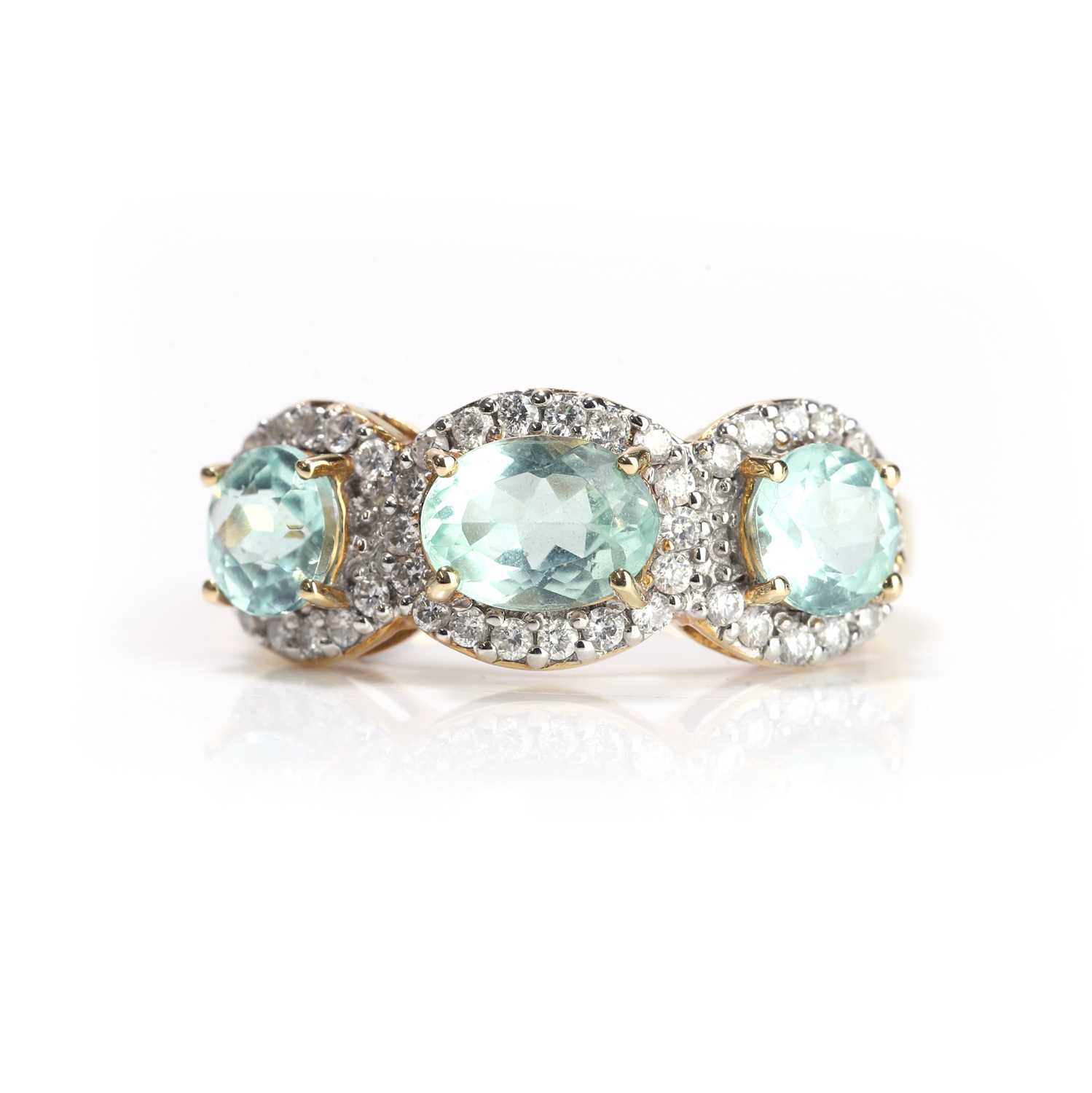 Lot 97 - An 18ct gold tourmaline and diamond three stone ring