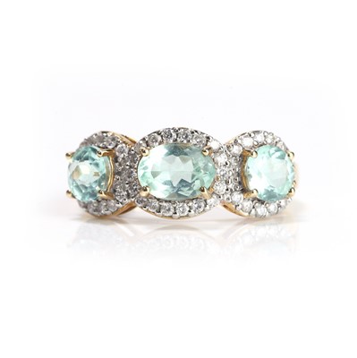 Lot 97 - An 18ct gold tourmaline and diamond three stone ring