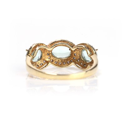 Lot 97 - An 18ct gold tourmaline and diamond three stone ring