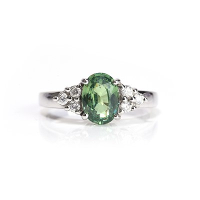 Lot 70 - An 18ct white gold green garnet and diamond ring