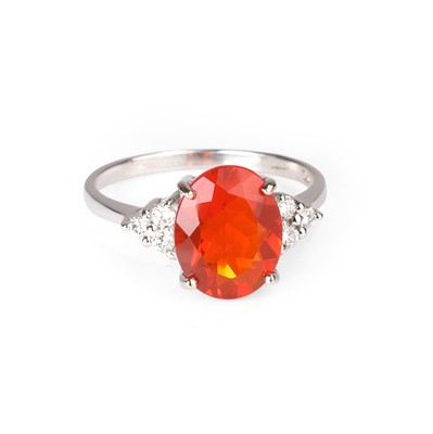 Lot 95 - An 18ct white gold fire opal and diamond ring