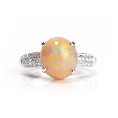 Lot 144 - An 18ct white gold opal and diamond ring