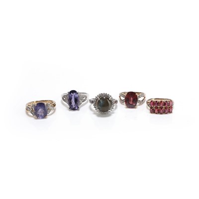 Lot 252 - A group of five gold and silver gemstone set rings
