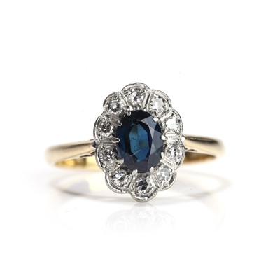 Lot 164 - A sapphire and diamond cluster ring