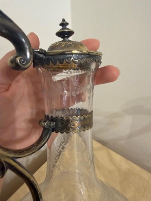 Lot 526 - A pair of Victorian etched glass and silver-gilt-mounted claret jugs