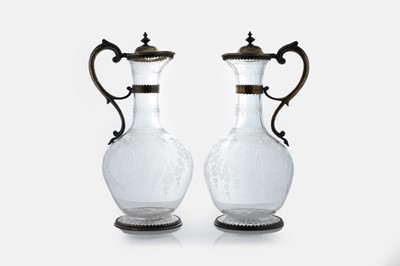 Lot 526 - A pair of Victorian etched glass and silver-gilt-mounted claret jugs