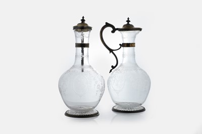 Lot 526 - A pair of Victorian etched glass and silver-gilt-mounted claret jugs