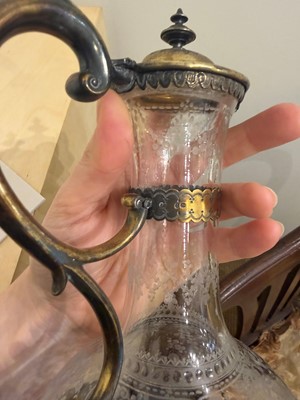 Lot 526 - A pair of Victorian etched glass and silver-gilt-mounted claret jugs