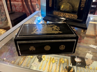 Lot 533 - An Art Deco ebonised and silver-plated cigarette box