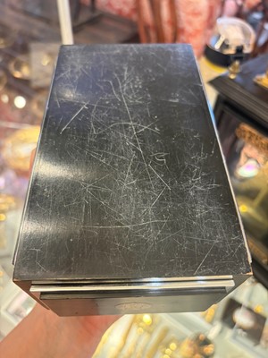 Lot 533 - An Art Deco ebonised and silver-plated cigarette box