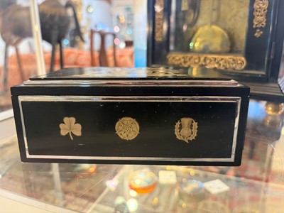 Lot 533 - An Art Deco ebonised and silver-plated cigarette box