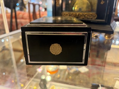 Lot 533 - An Art Deco ebonised and silver-plated cigarette box