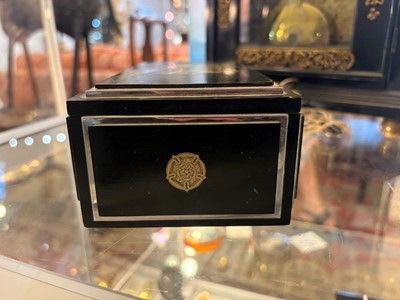 Lot 533 - An Art Deco ebonised and silver-plated cigarette box