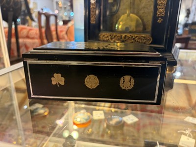 Lot 533 - An Art Deco ebonised and silver-plated cigarette box