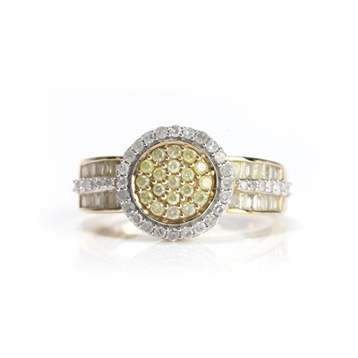 Lot 65 - A 9ct gold coloured diamond and diamond cluster ring
