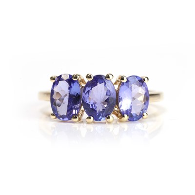 Lot 107 - An 18ct gold tanzanite three stone ring