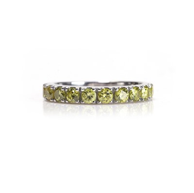 Lot 62 - A fancy coloured diamond half eternity ring