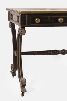 Lot 534 - A Regency ebonised and parcel-gilt writing table