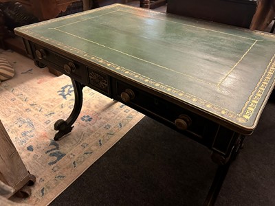 Lot 534 - A Regency ebonised and parcel-gilt writing table