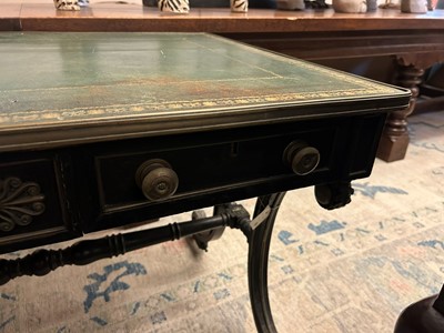 Lot 534 - A Regency ebonised and parcel-gilt writing table