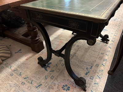 Lot 534 - A Regency ebonised and parcel-gilt writing table