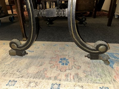 Lot 534 - A Regency ebonised and parcel-gilt writing table