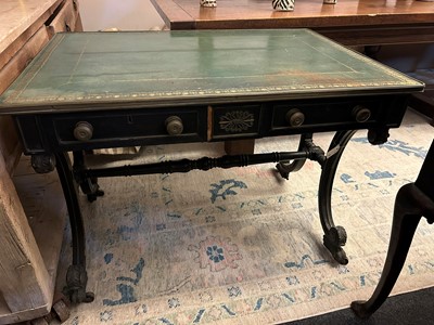 Lot 534 - A Regency ebonised and parcel-gilt writing table