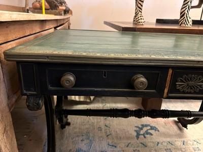 Lot 534 - A Regency ebonised and parcel-gilt writing table