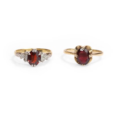 Lot 195 - An 18ct gold garnet and diamond ring and a 9ct gold garnet single stone ring