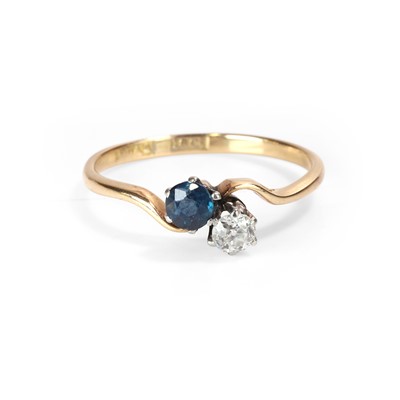 Lot 52 - A diamond and sapphire Toi et Moi ring