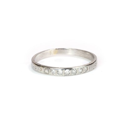 Lot 113 - A white gold diamond half eternity ring