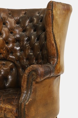 Lot 193 - A George III-style barrel-back leather armchair