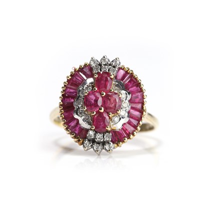 Lot 57 - A ruby and diamond ballerina style cluster ring