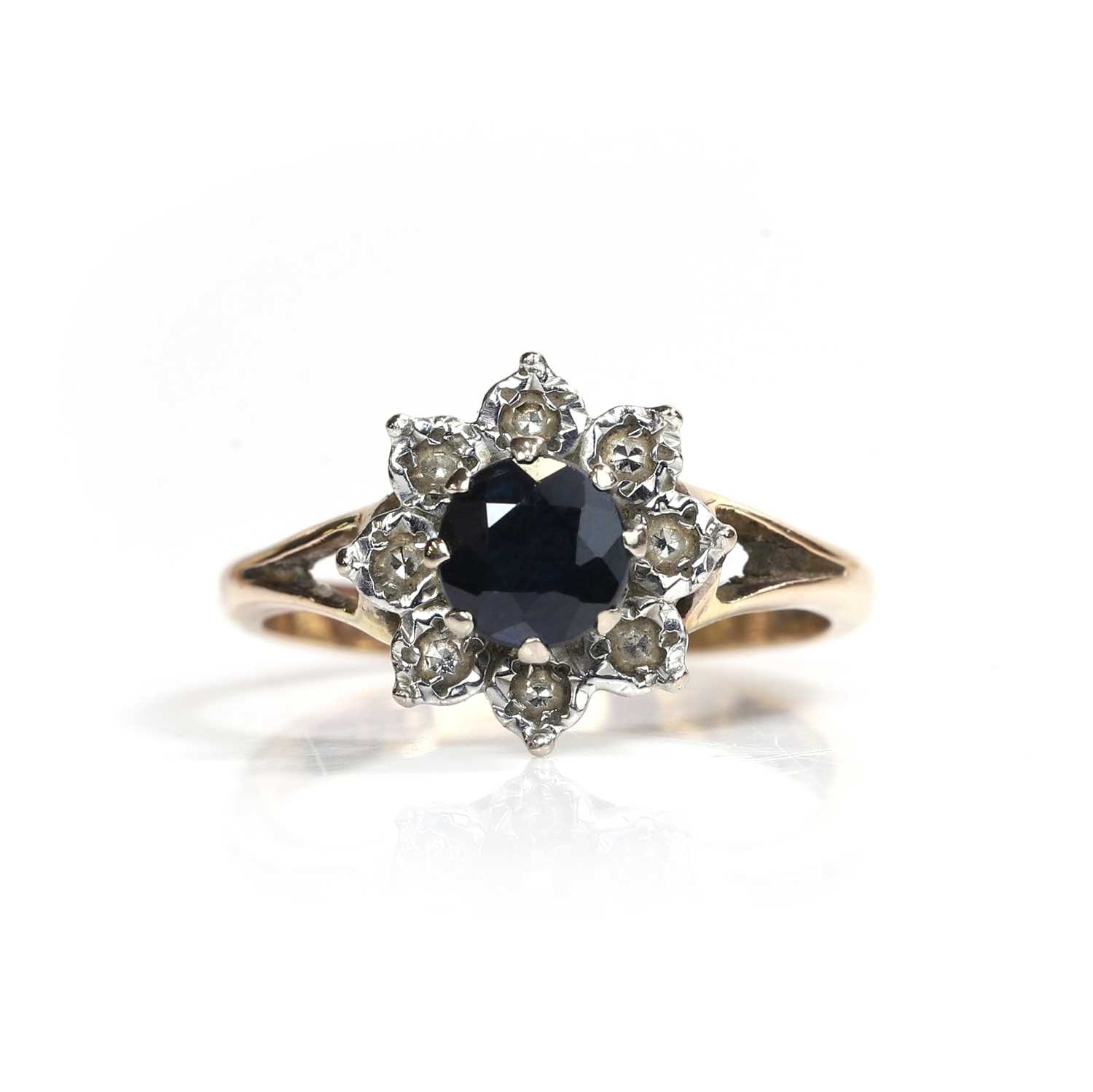 Lot 82 - A 9ct gold sapphire and diamond cluster ring