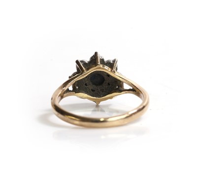 Lot 82 - A 9ct gold sapphire and diamond cluster ring