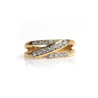 Lot 61 - An 18ct gold diamond crossover ring