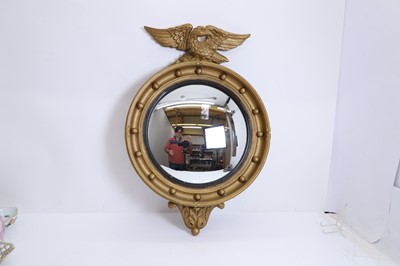 Lot 495 - A gilt convex mirror