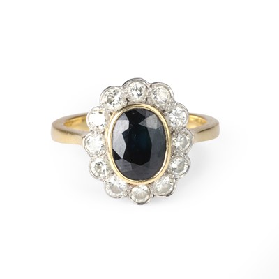 Lot 53 - An 18ct gold sapphire and diamond cluster ring