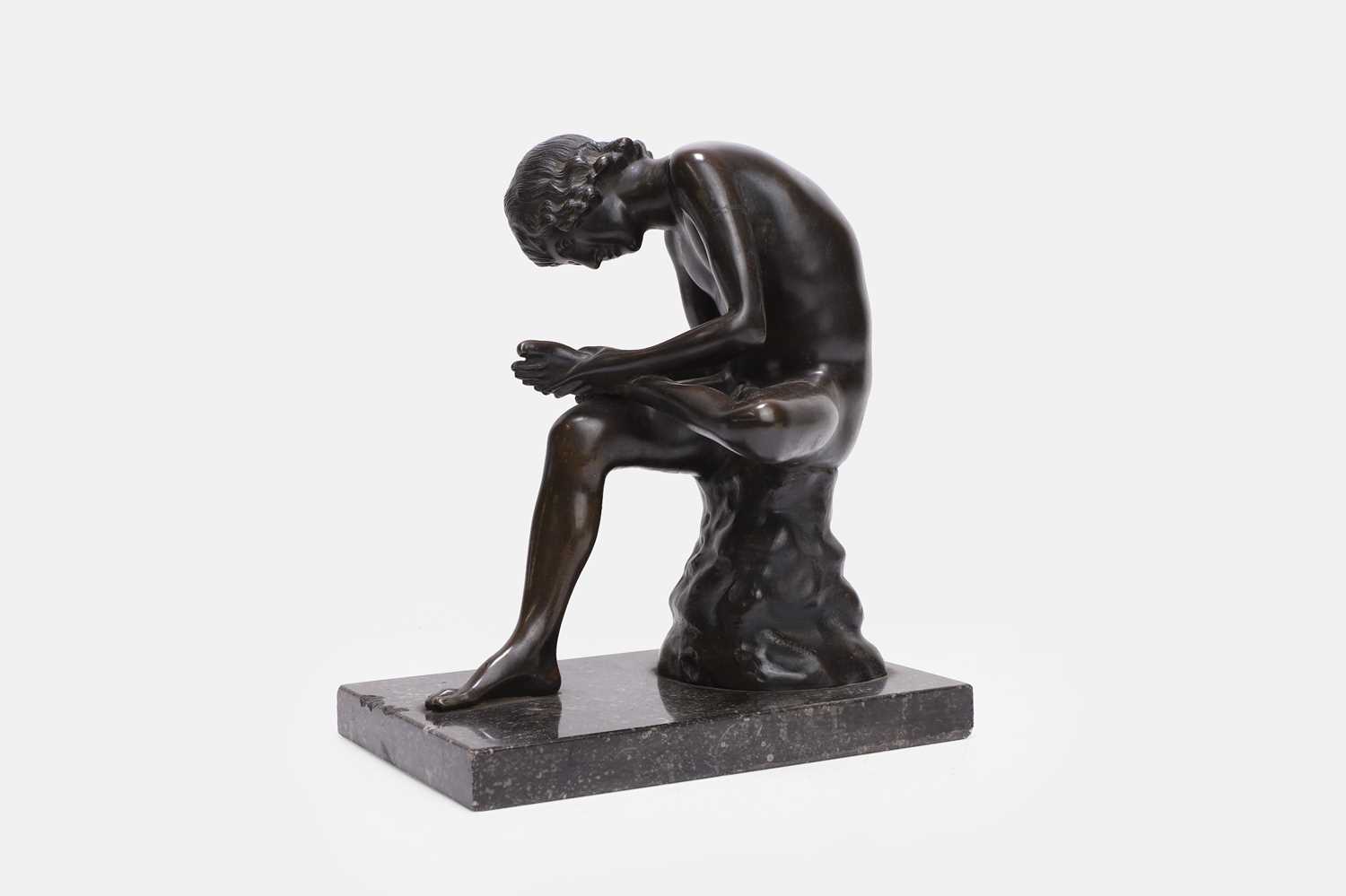 Lot 48 - A patinated bronze figure of the Spinario