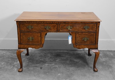 Lot 517A - A George I style walnut writing table