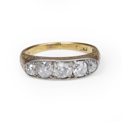 Lot 32 - A diamond five stone carved half hoop ring