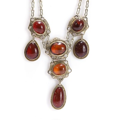 Lot 180 - An Arts and Crafts bib style amber necklace
