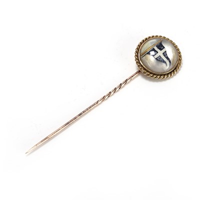 Lot 35 - A reverse painted intaglio or Essex crystal stick pin