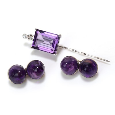Lot 294 - An amethyst and diamond stick pin and a pair of amethyst set cufflinks