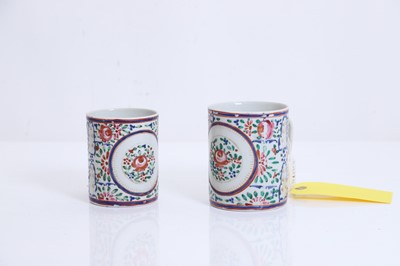 Lot 63 - A near pair of Chinese Export mugs