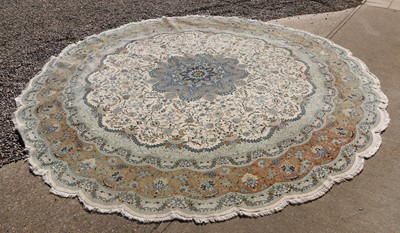 Lot 424 - An Iranian Tabriz wool and silk blend circular rug