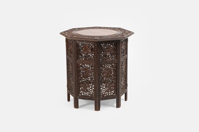 Lot 502 - A carved padouk octagonal table