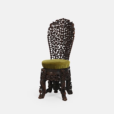 Lot 278 - An Anglo-Indian carved hardwood 'slipper' chair