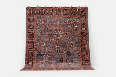Lot 356 - A wool carpet of antique North-West Persian design